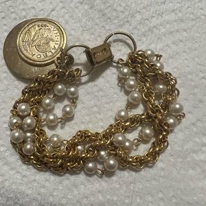 Celebrity Stamped brand beautiful gold tone with white beaded bracelet